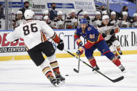 Anaheim Ducks' Simon Benoit (86) defends against St. Louis Blues' Ryan O'Reilly (90) during the second period of an NHL hockey game on Wednesday, May 5, 2021, in St. Louis. (AP Photo/Joe Puetz)