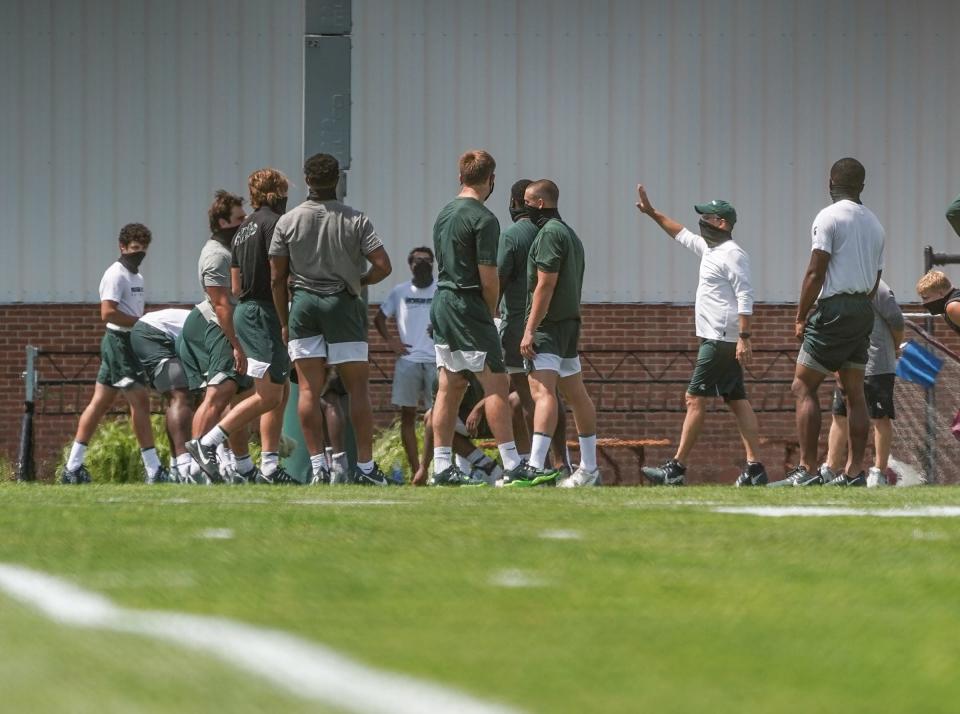 Michigan State football players go through an off-day walk-through on the MSU practice field on the campus in East Lansing on Monday, August 10, 2020.