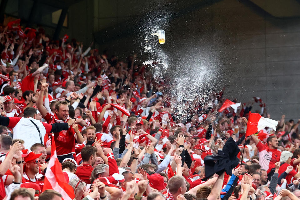 Seen here, Denmark fans celebrate their side's second goal scored by Yussuf Poulsen against Russia.