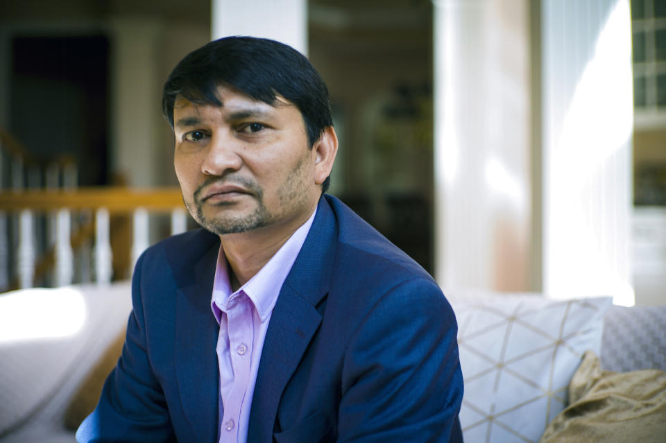 D.B. Sagar, president and founder of International Commission for Dalit Rights, Monday, Feb. 13, 2023, at his home in Lorton, Va. Sagar's civil rights work is fighting a system that dates back to antiquity in South Asia. Growing up in Nepal, his family was Dalit and practicing elements of both Hinduism and Buddhism. Sagar said they felt shunned by both faiths. “We were not allowed to participate in village festivals or enter temples,” he said. “Buddhists did not allow anyone from the Dalit community to become monks. You could change your religion, but you still cannot escape your caste identity. If converting to another religion was a solution, people would be free from caste discrimination by now.” (AP Photo/John C. Clark)