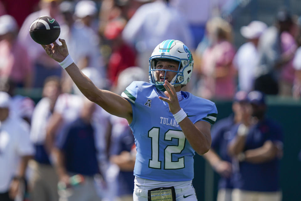 Tulane quarterback Kai Horton (12) passes In the first half of an NCAA college football game against Mississippi in New Orleans, Saturday, Sept. 9, 2023. (AP Photo/Gerald Herbert)