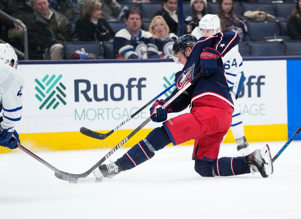 Columbus Blue Jackets left wing Patrik Laine (29) tries to make a pass from his knees during the third period of the NHL hockey game against the Toronto Maple Leafs at Nationwide Arena in Columbus on March 7, 2022. The Blue Jackets lost 5-4.