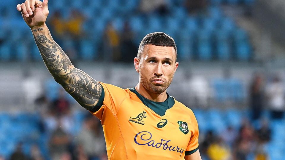 Pictured here, Wallabies fly-half Quade Cooper salutes fans after a Test match in 2021.