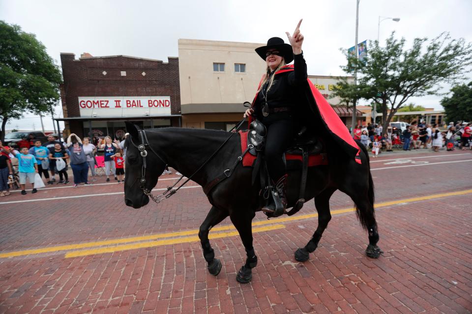 Texas Tech Masked Rider Ashley Adams rides in the 31st annual 4th on Broadway Independence Day parade and festival Saturday, July 3rd, 2021.