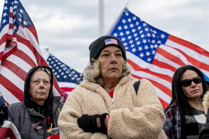 Micki Witthoeft stands with supporters of protesters that were arrested at the Capitol on Jan. 6, 2021.