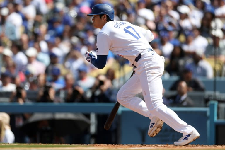 Japanese star Shohei Ohtani of the Los Angeles Dodgers singles in the fifth inning of his home debut for the Dodgers, a 7-1 triumph over St. Louis (Sean M. Haffey)