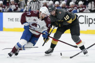 Vegas Golden Knights center Nicolas Roy (10) breaks a stick on Colorado Avalanche center Tyson Jost (17) during the third period in Game 6 of an NHL hockey Stanley Cup second-round playoff series Thursday, June 10, 2021, in Las Vegas. (AP Photo/John Locher)