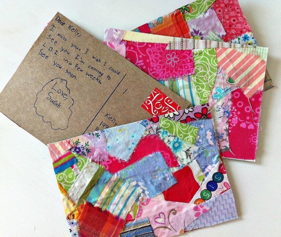 Colorful homemade postcards made of cardboard and covered with fabric swatches.