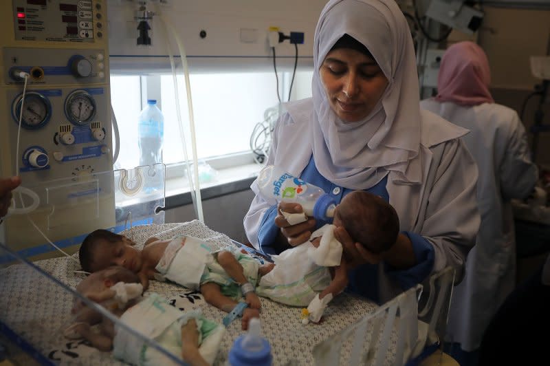 Palestinian medics care for babies evacuated from Al Shifa hospital to the Emirates hospital in Rafah in the southern Gaza Strip on Sunday. Photo by Ismail Muhammad/UPI