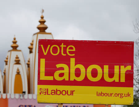 A vote Labour sign is seen near the Gita Bhavan Hindu Temple in Whalley Range, Manchester, Britain April 20, 2017. REUTERS/Andrew Yates