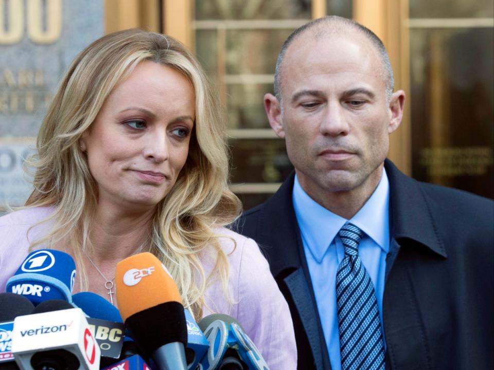 Daniels and Avenatti, right talk to the media as she leaves federal court in New York in 2018; for a time, the pair – and especially outspoken Avenatti – were ubiquitous on television (AP)