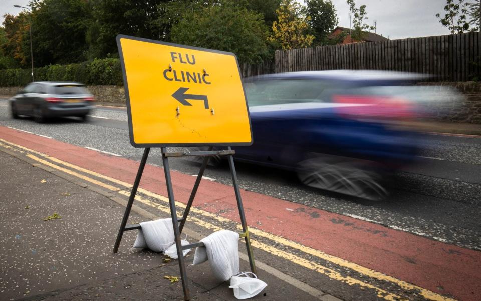 A sign directs drivers to a drive-in flu clinic in Edinburgh - PA/Jane Barlow