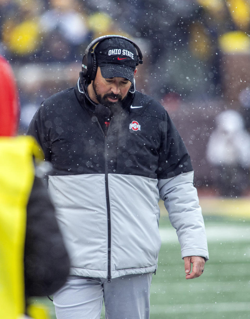 FILE - Ohio State head coach Ryan Day wears a headset on the sideline in the first quarter of an NCAA college football game against Michigan in Ann Arbor, Mich., Saturday, Nov. 27, 2021. Michigan won 42-27. (AP Photo/Tony Ding, File)