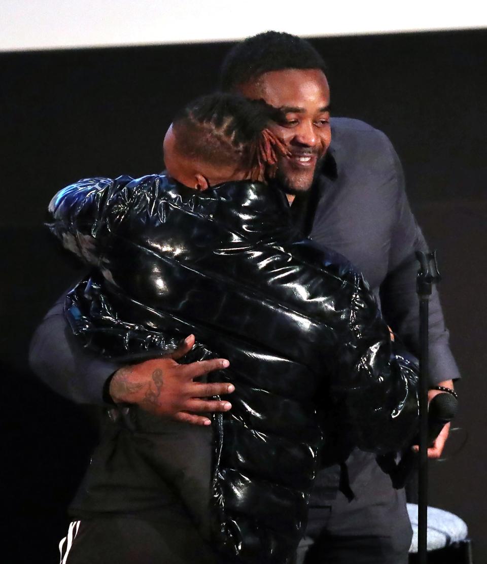 Ohio Innocence Project's newest freed client Michael Sutton, facing, hugs his friend Kenny Phillips after speaking to students at the University of Akron student union, Wednesday, March 1, 2023, in Akron, Ohio.