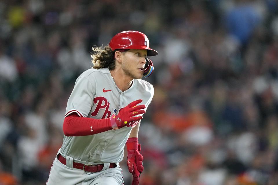 Philadelphia Phillies' Alec Bohm runs up the first base line after hitting an RBI double against the Houston Astros during the eighth inning of a baseball game Saturday, April 29, 2023, in Houston. (AP Photo/David J. Phillip)