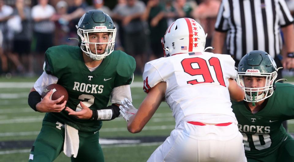Trinity’s Andrew Allen kept the ball and ran against Center Grove in the 2nd quarter.Sept. 2, 2022