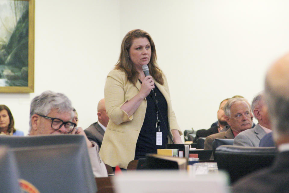 Rep. Erin Pare, the only Republican who represents part of Wake County, asks the North Carolina House of Representatives not to concur on a bill that would remove a masking health exemption on the House floor in the Legislative Building on Wednesday, May 22, 2024, in Raleigh, N.C. The bill, which also enhances penalties for people who wear a mask while committing a crime, will go to a conference committee to negotiate revisions. (AP Photo/Makiya Seminera)