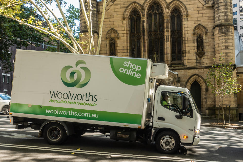 Woolworths delivery truck parked outside a building. Source: Getty Creative