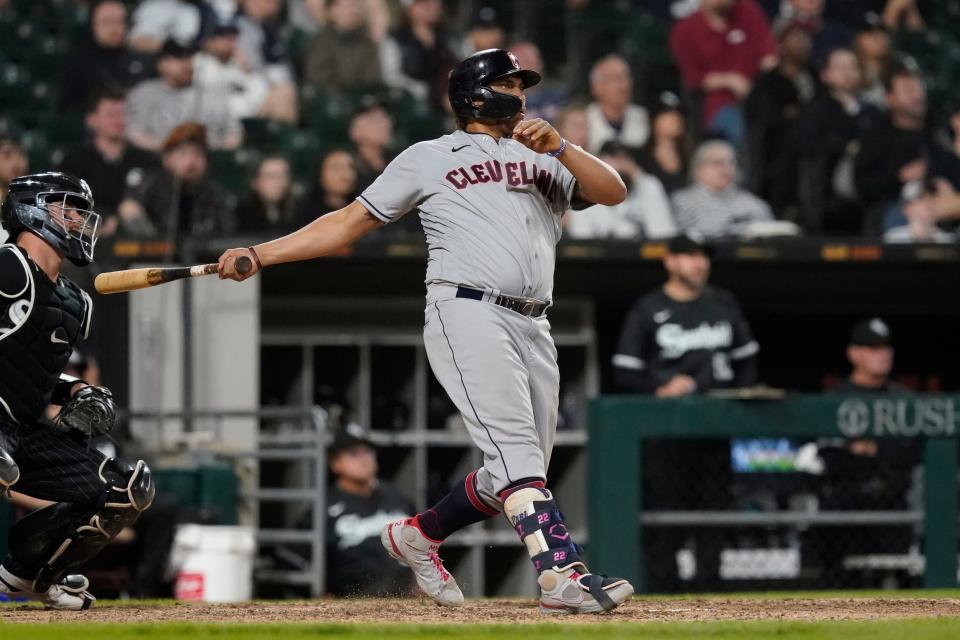 Guardians first baseman Josh Naylor watches his three-run home run off Chicago White Sox relief pitcher Ryan Burr during the 11th inning of Monday night's game. The Guardians won 12-9. [Charles Rex Arbogast/Associated Press]