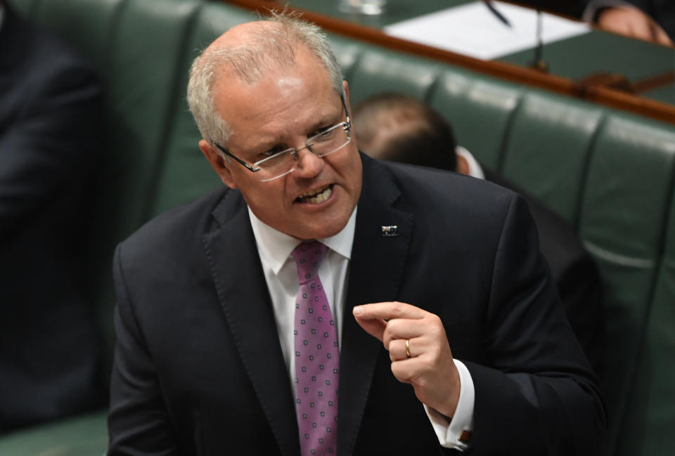 CANBERRA, AUSTRALIA - NOVEMBER 26: Prime Minister Scott Morrison reacts to questions about Energy Minister Angus Taylor in the House of Representatives during Question Time at Parliament House on November 26, 2019 in Canberra, Australia. Minister for Energy Angus Taylor is being investigated over a doctored document which was used to politically attach Sydney Lord Mayor Clover Moore. (Photo by Tracey Nearmy/Getty Images)