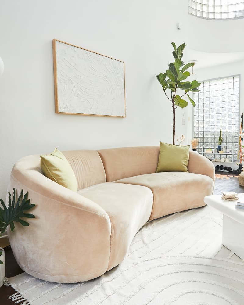 Curved sofa in living room.