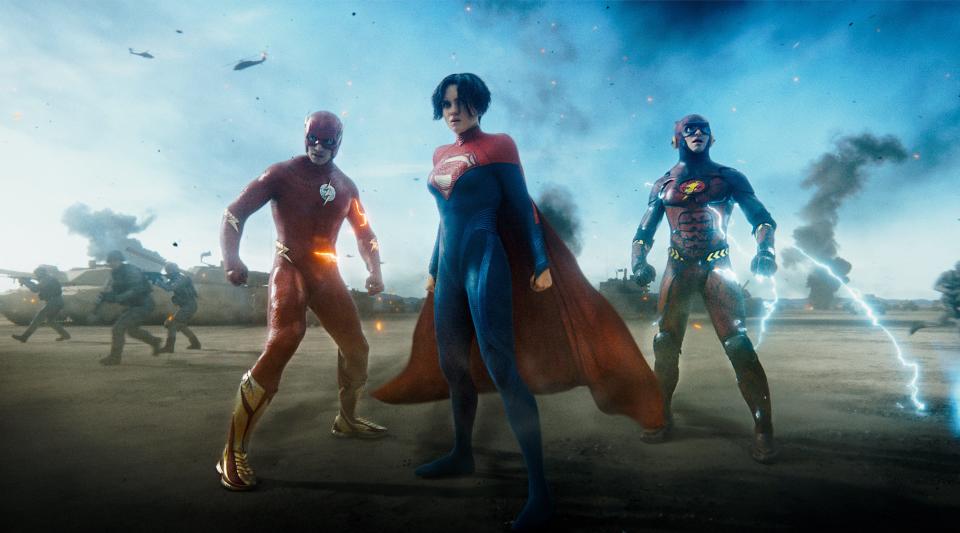 A debuting Supergirl (Sasha Calle, center) teams with multiple versions of the title speedster (Ezra Miller) in the DC superhero movie "The Flash."