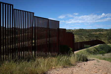 Different generations of the U.S. border wall with Mexico are seen from the United States in Nogales, Arizona, September 13, 2018. REUTERS/Adrees Latif