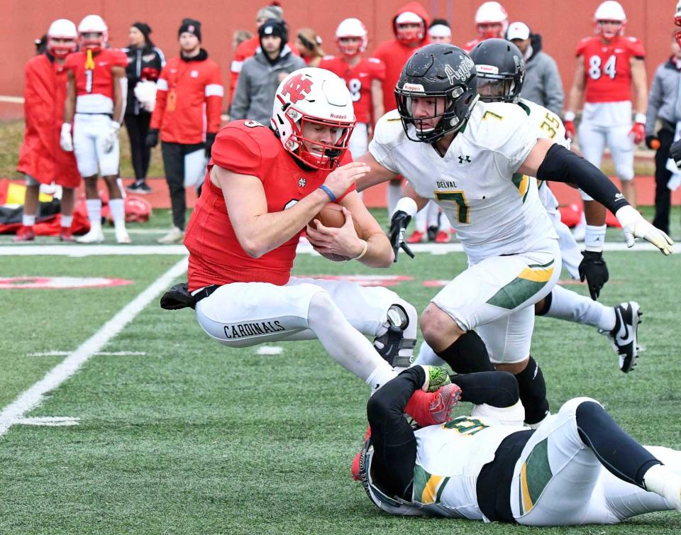 DelVal defensive linemen Anthony Nobile (9) and Michael Nobile (7) combine for sack of North Central quarterback Broc Rutter in the Aggies' 2019 NCAA Division III quarterfinal loss. North Central went on to win the national title.