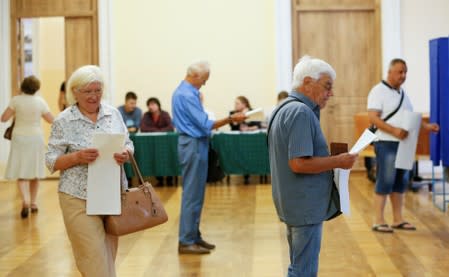 Voters visit a polling station during Ukraine's parliamentary election in Kiev