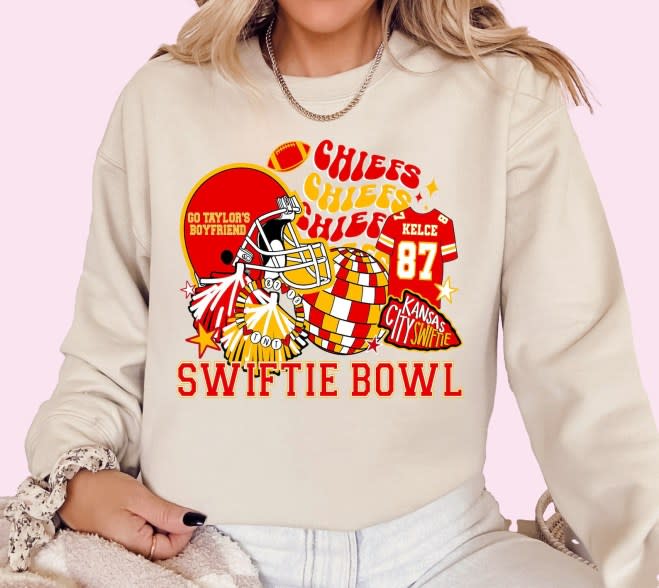 Sweatshirts read “Swiftie Bowl” and “Go Taylor’s Boyfriend.”