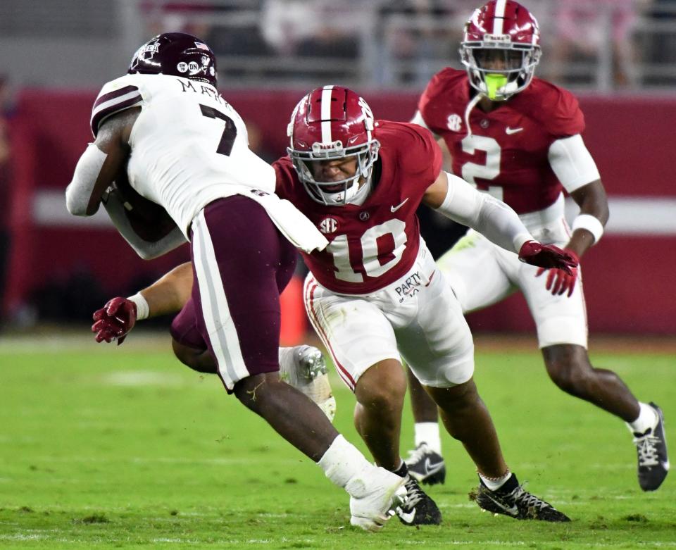 Alabama Crimson Tide LB Henry To'o To'o (10) makes a tackle against Mississippi State Bulldogs RB Jo'quavious Marks (7) during the first half at Bryant-Denny Stadium.