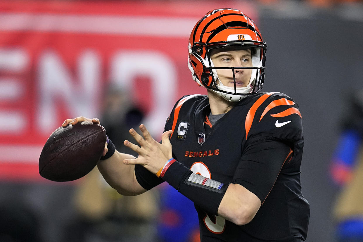 FILE - Cincinnati Bengals quarterback Joe Burrow throws in the second half of an NFL wild-card playoff football game against the Baltimore Ravens in Cincinnati, Sunday, Jan. 15, 2023. Burrow edged Josh Allen for the No. 2 spot by one point despite being left off two ballots due to his calf injury. (AP Photo/Darron Cummings, File)