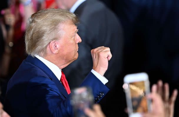PHOTO: Former President Donald Trump makes a fist as he arrives to speak during a press conference following his court appearance over an alleged 'hush-money' payment, at his Mar-a-Lago estate in Palm Beach, Fla., on April 4, 2023. (Chandan Khanna/AFP via Getty Images)