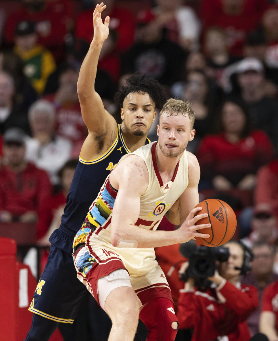 Nebraska's Rienk Mast, right, drives against Michigan's Terrance Williams II during the second half of an NCAA college basketball game, Saturday, Feb. 10, 2024, in Lincoln, Neb. (AP Photo/Rebecca S. Gratz)