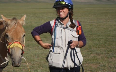 Camilla Swift with her companion on the Mongol Derby - Credit: Camilla Long