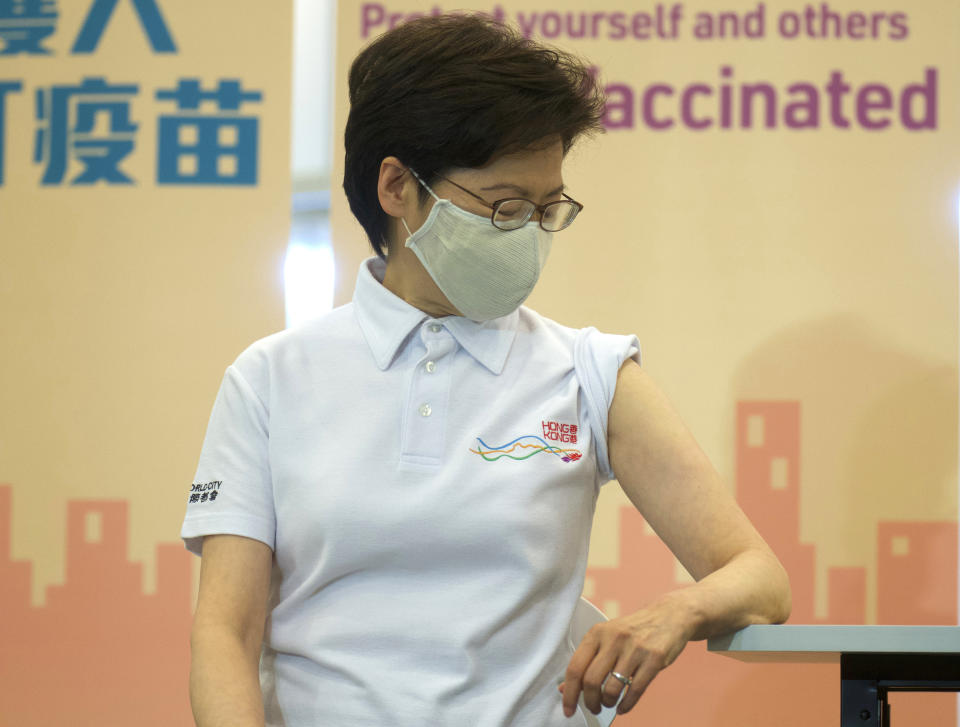 Hong Kong Chief Executive Carrie Lam waits to receive COVID-19 vaccinations at a Community Vaccination Centre in Hong Kong Monday, Feb. 22, 2021. Hong Kong leader Carrie Lam and a host of other government officials on Monday received the COVID-19 vaccine developed by Chinese biopharmaceutical company Sinovac, as the city prepares to roll out its vaccination program. (AP Photo/Vincent Yu)