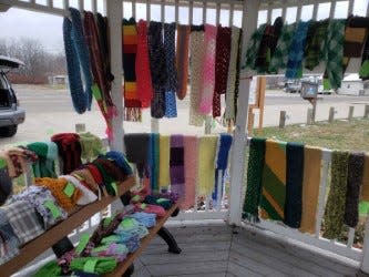 Scarves hang inside the gazebo in Uhrichsville on Nov. 18 for the seventh year of the Scarf Project.