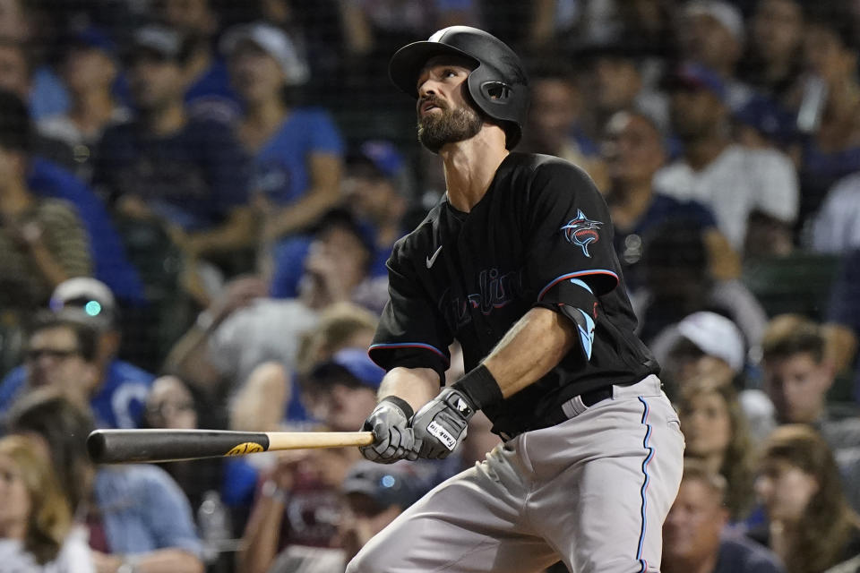 Miami Marlins' Jon Berti watches his three-run home run during the sixth inning of the team's baseball game against the Chicago Cubs in Chicago, Friday, June 18, 2021. (AP Photo/Nam Y. Huh)