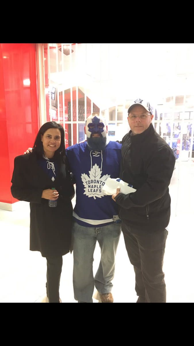 Auston Mathews' parents with 'Dart Guy' at Game 3. 