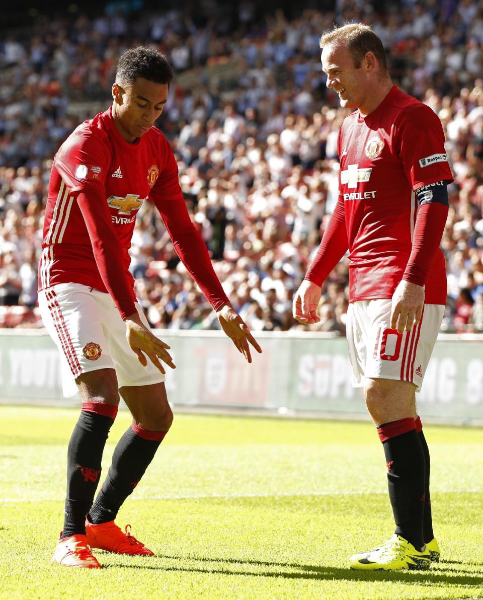 Football Soccer Britain - Leicester City v Manchester United - FA Community Shield - Wembley Stadium - 7/8/16 Manchester United's Jesse Lingard celebrates with Wayne Rooney after scoring their first goal Action Images via Reuters / John Sibley Livepic EDITORIAL USE ONLY. No use with unauthorized audio, video, data, fixture lists, club/league logos or "live" services. Online in-match use limited to 45 images, no video emulation. No use in betting, games or single club/league/player publications. Please contact your account representative for further details.