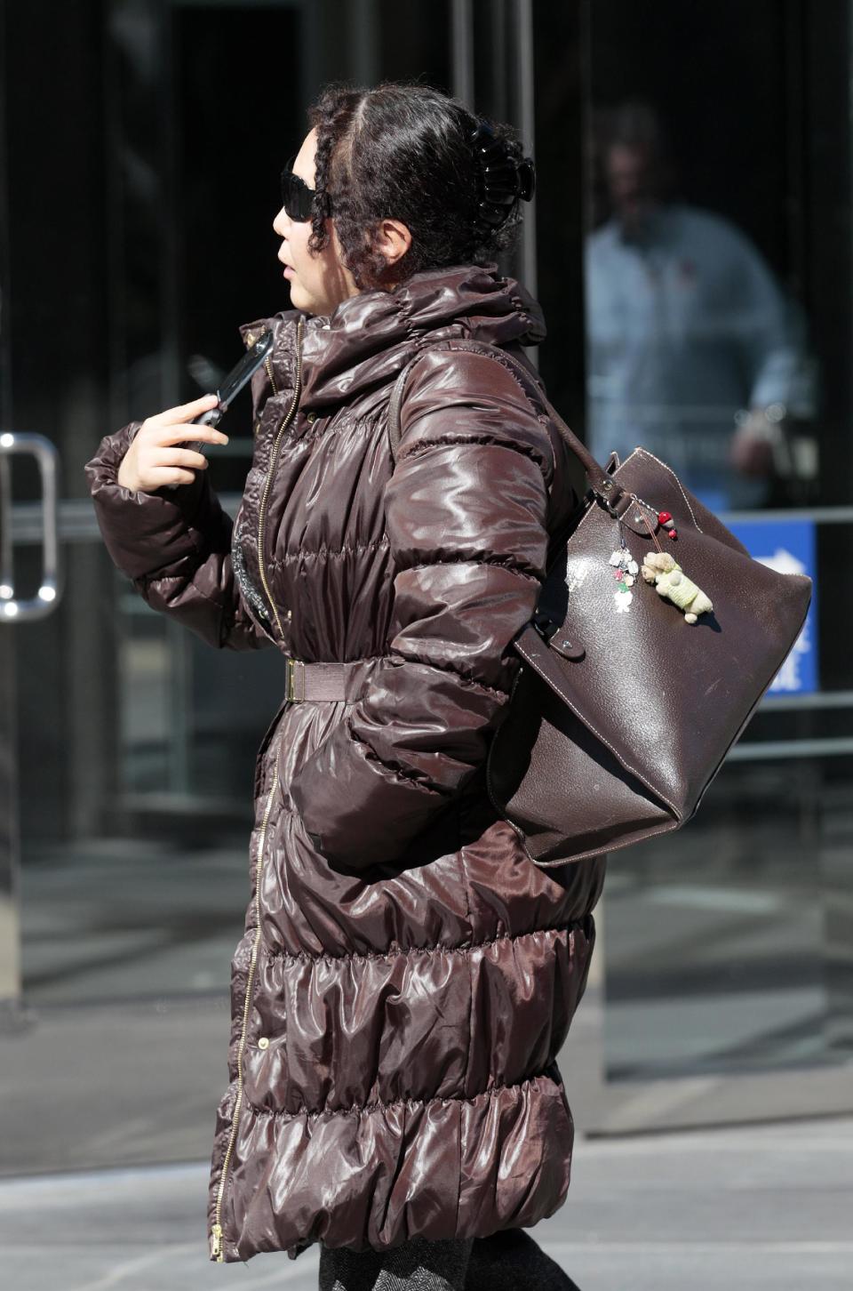 Christina Liew walks out of a federal courthouse in San Francisco, Thursday, March 8, 2012. Liew, who is accused of helping her husband Walter Liew steal trade secrets from DuPont and selling them to a company owned by the Chinese government, pleaded not guilty to economic espionage charges in San Francisco federal court Thursday. (AP Photo/Jeff Chiu)