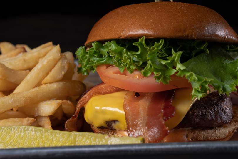 The half-pound burger at American Icon Brewery in Vero Beach is thick and juicy on a large, soft bun.