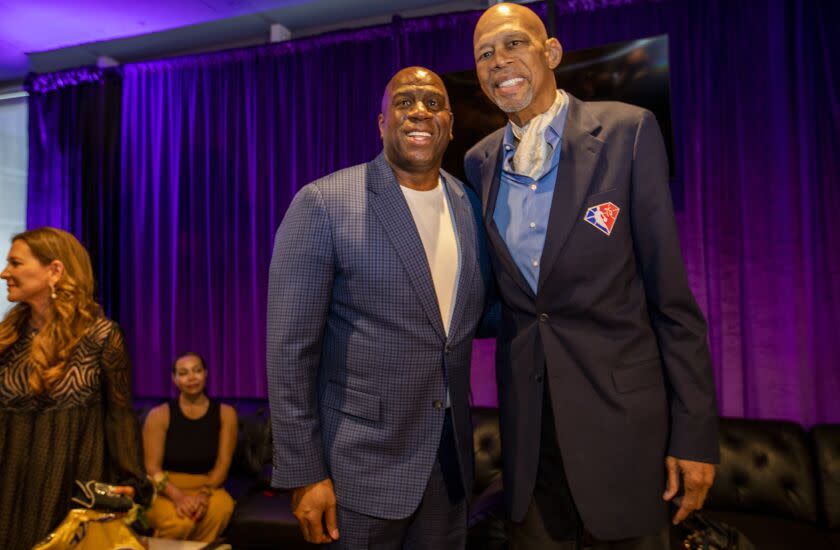 Magic Johnson, left, and Kareem Abdul-Jabbar, right, celebrate Kareem's birthday in the Lakers Lounge at Crypto.com