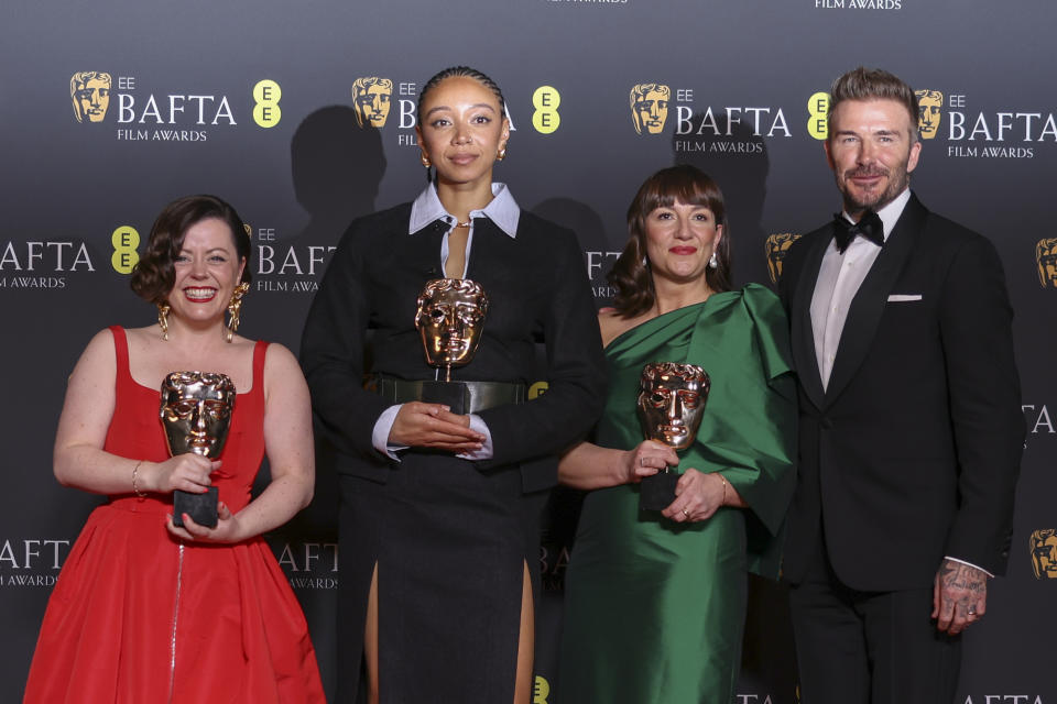 Producer Medb Riordan, from left, director Savanah Leaf, producer Shirley O'Connor, winners of the outstanding debut by a british writer, director or producer award for 'Earth Mama' and David Beckham, pose for photographers at the 77th British Academy Film Awards, BAFTA's, in London, Sunday, Feb. 18, 2024. (Photo by Vianney Le Caer/Invision/AP)