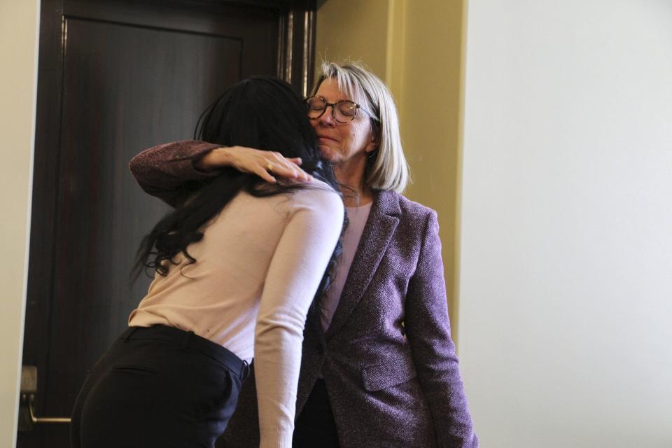 Nancy Halden, right, spokesperson for the Gun Violence Prevention Center of Utah, hugs Nia Maile, who spoke about losing her two brothers to gun violence, at the Utah State Capitol in Salt Lake City on Monday, March 4, 2024. Gun violence prevention advocates who gathered Monday at the Utah State Capitol called on Gov. Spencer Cox to veto legislation that they said could place children in harm's way by training more teachers to carry firearms on campus. (AP Photo/Hannah Schoenbaum)