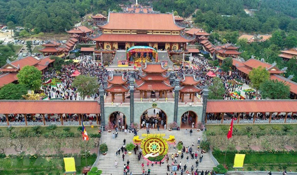 In this undated photo, visitors fill the courtyard of the Ba Vang pagoda in Uong Bi city, Quang Ninh province, Vietnam. Vietnamese authorities have ordered monks at a popular Buddhist pagoda to stop “soul summoning” and “bad karma eviction” ceremonies, saying such rituals violate the country’s law on religion and folk beliefs. According to the state-run Lao Dong newspaper, worshippers have been paying the 18th century Ba Vang pagoda in northern Vietnam 1 million Vietnamese dong to several hundred million dong ($45-$13,500) to have their bad karma vanquished. (Vietnam News Agency via AP)