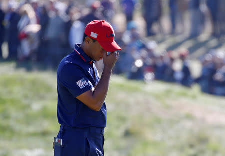 FILE PHOTO: Golf - 2018 Ryder Cup at Le Golf National - Guyancourt, France - September 30, 2018 - Team USA's Tiger Woods reacts during the Singles REUTERS/Regis Duvignau/File Photo