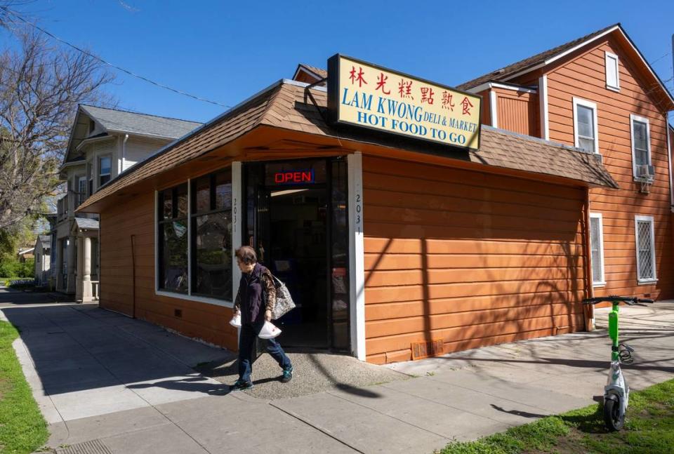A customer walks out of the Lam Kwong Deli & Market on March 20.