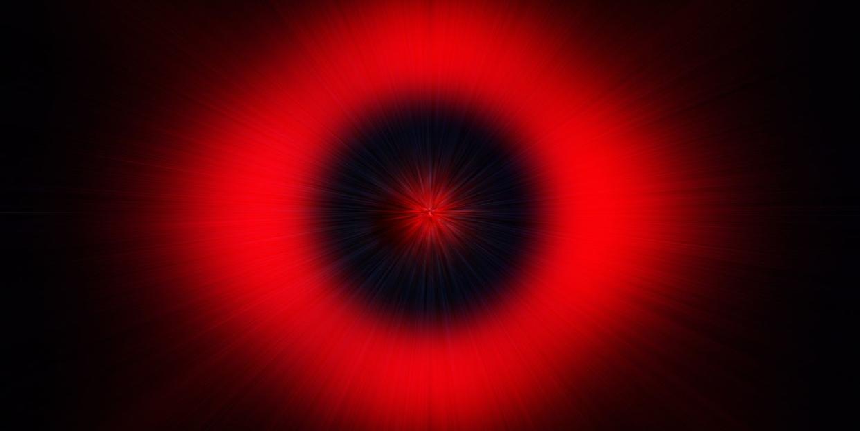 abstract background with red light trails attracted by a black hole on a black background