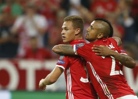 Football Soccer - Bayern Munich v FC Rostov - Champions League - Allianz Arena, Munich, Germany - 13/9/16 Bayern Munich's Joshua Kimmich celebrates with his team mate Arturo Vidal after scoring a goal. REUTERS/Michaela Rehle